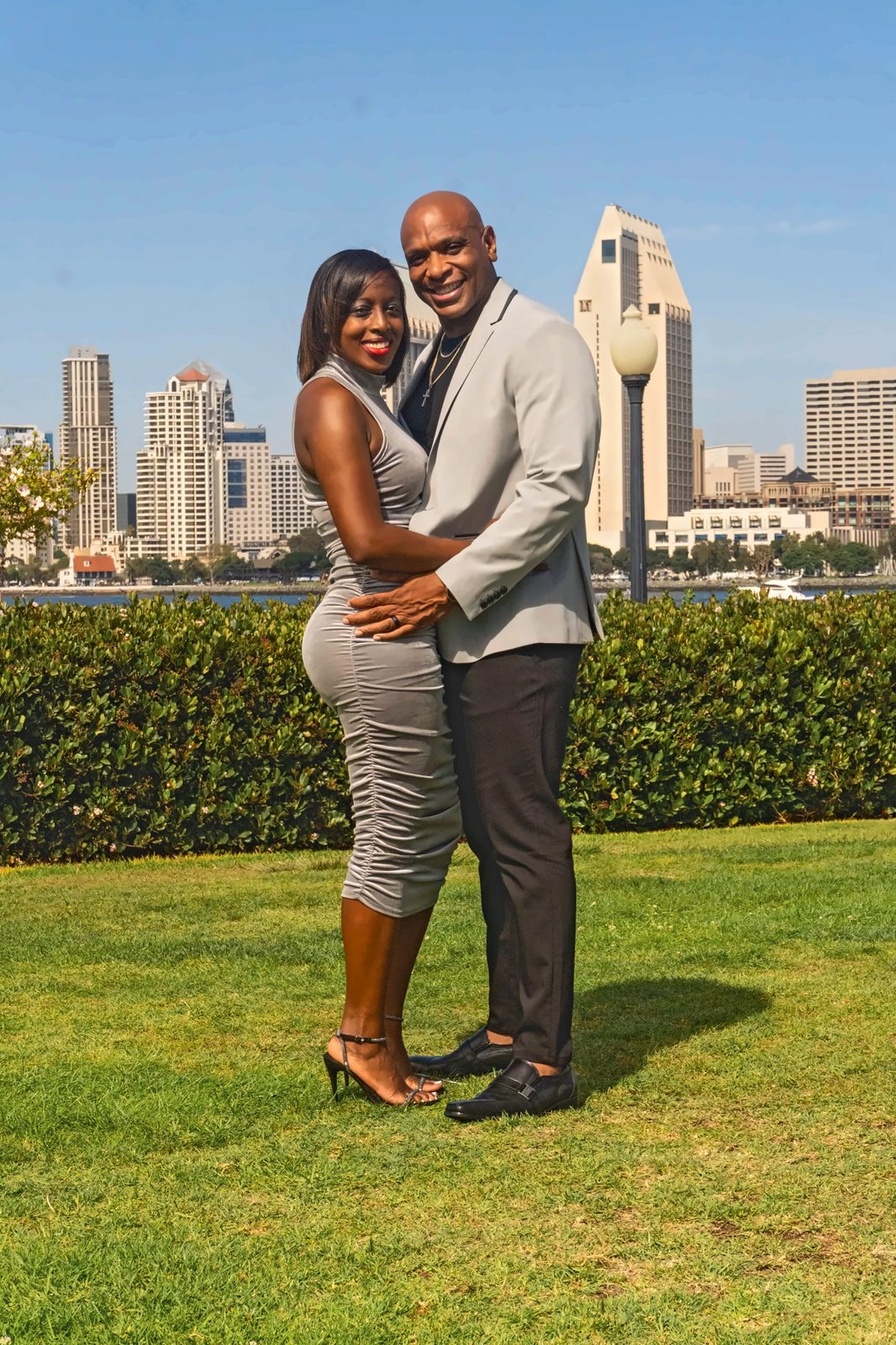 Couple embracing and smiling toward the camera